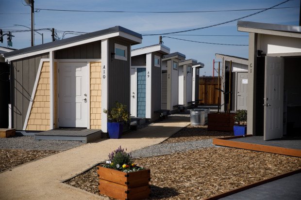 A row of small houses AI-generated content may be incorrect.